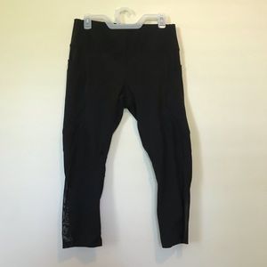Black leggings with pockets and mesh on the bottom